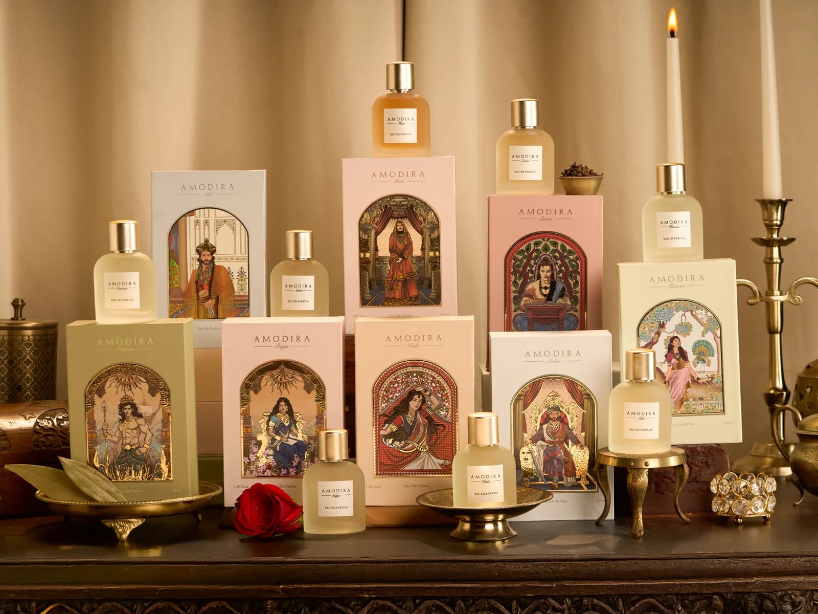 Amodira’s eight perfumes with their illustrated royal packaging.